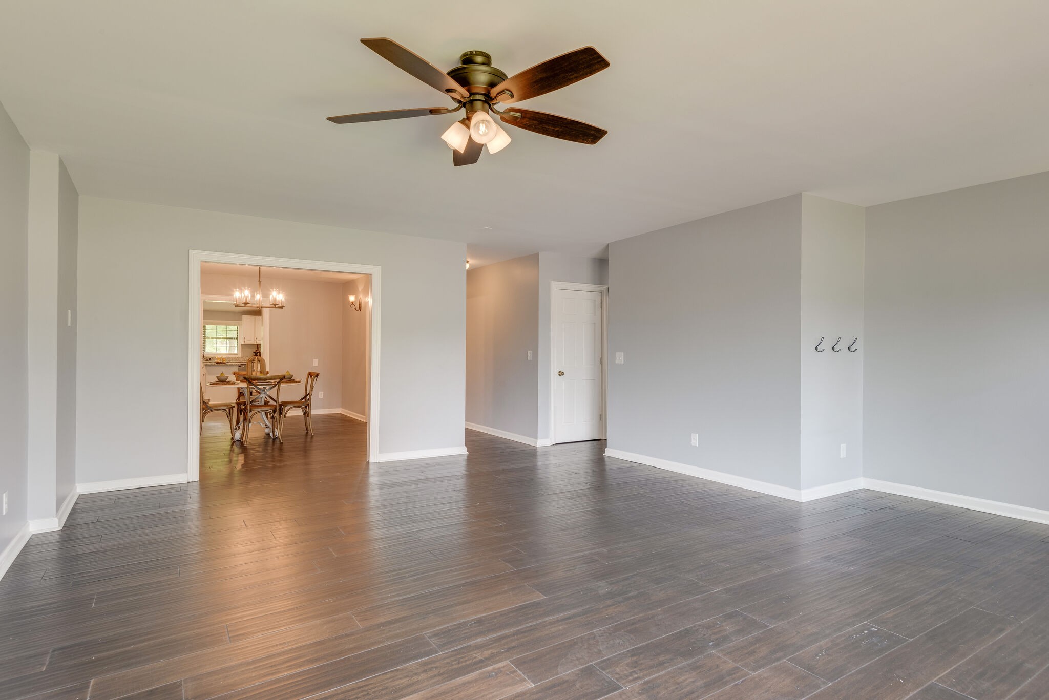 6201 Ladd Road Franklin, TN 37067 - Photo 2 of 28 a view of empty room with wooden floor and a ceiling fan