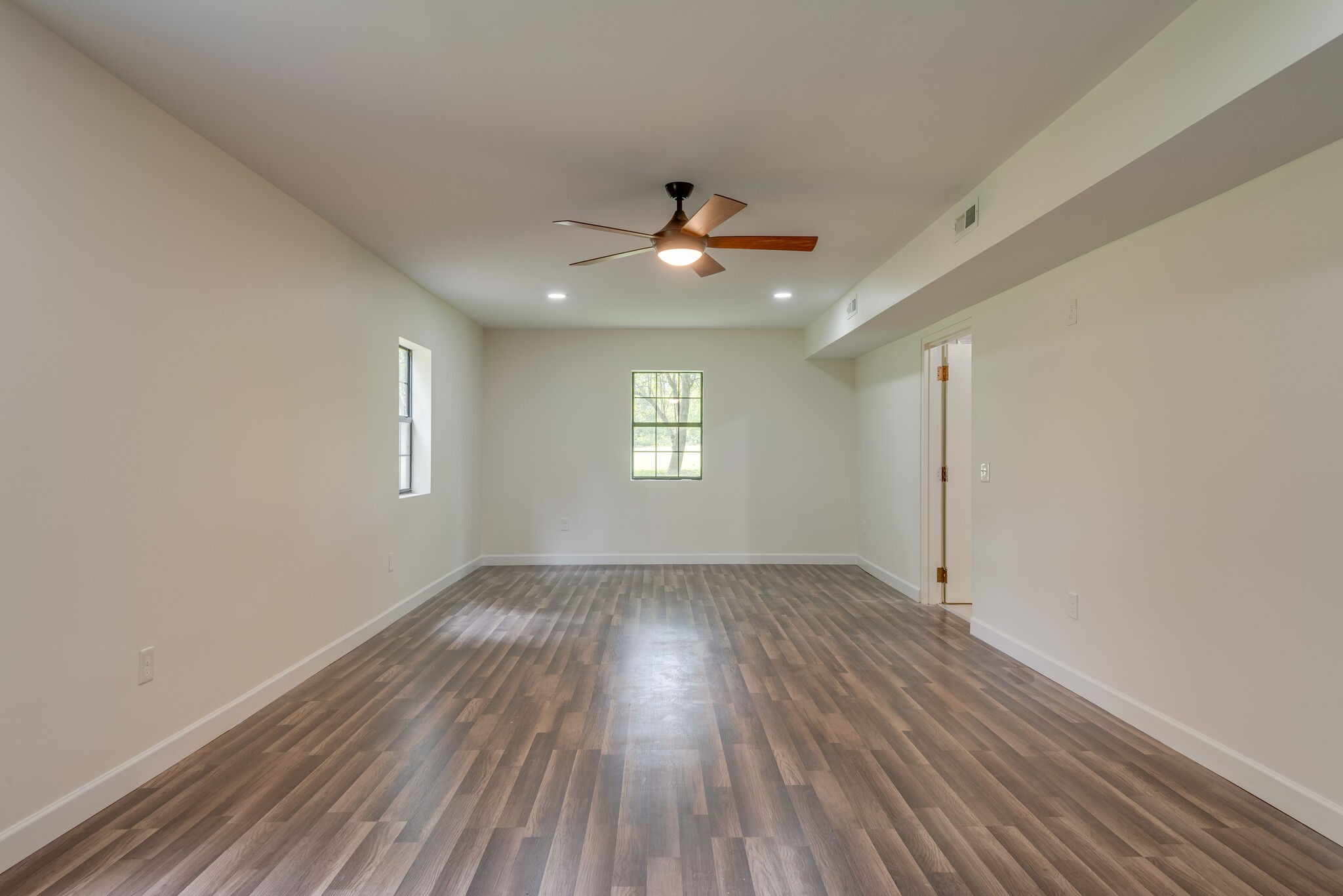 6201 Ladd Road Franklin, TN 37067 - Photo 23 of 28 an empty room with wooden floor and windows
