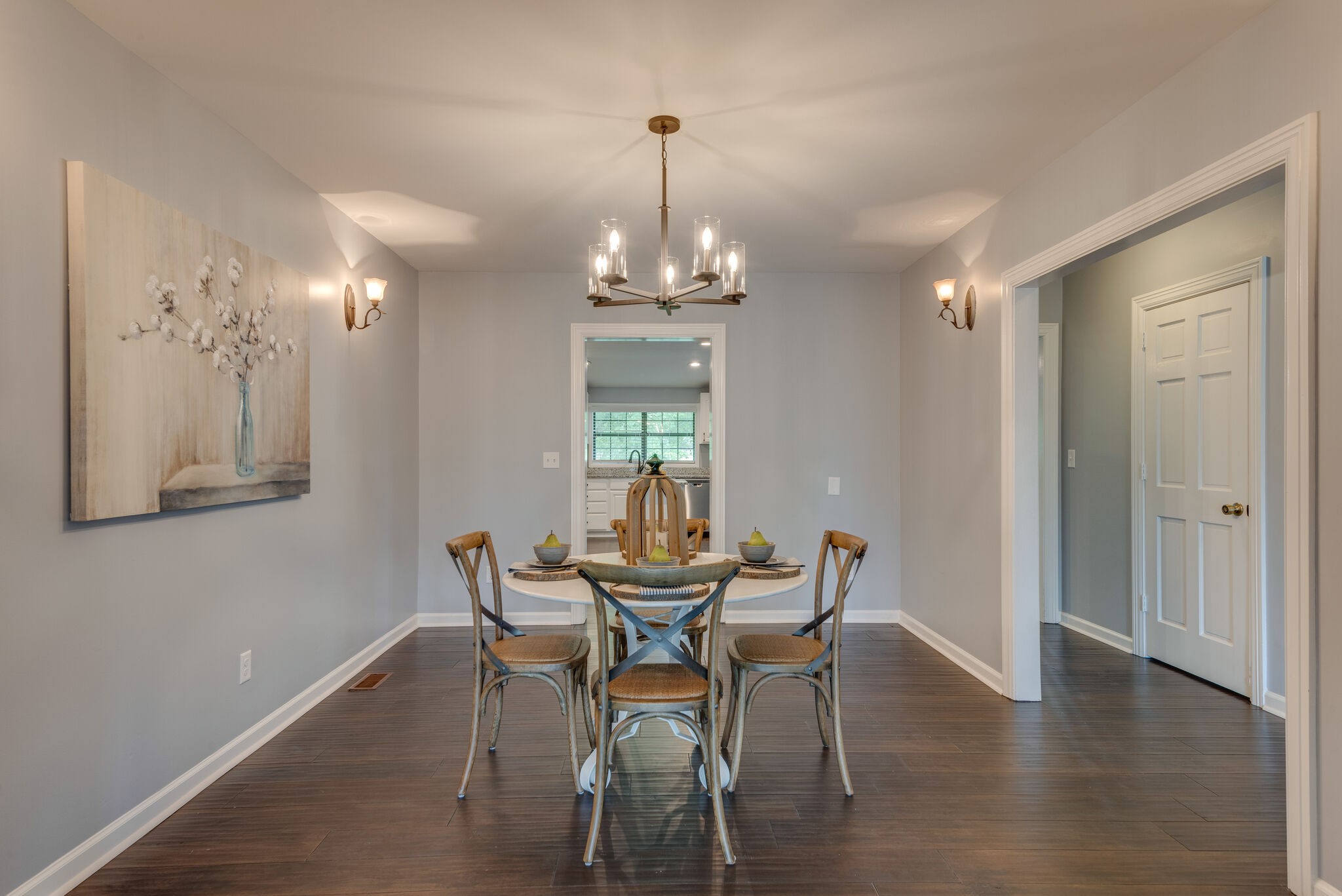6201 Ladd Road Franklin, TN 37067 - Photo 7 of 28 a dining room with furniture a chandelier and wooden floor