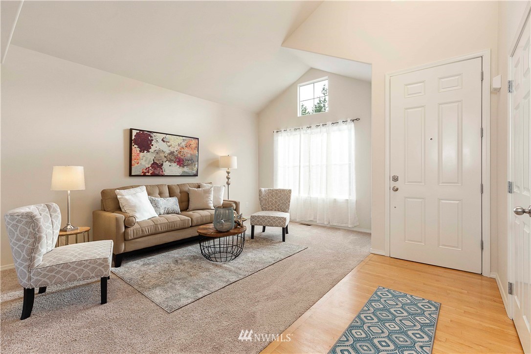 20117 Bartlett Road Bothell, WA 98012 - Photo 3 of 32 a living room with furniture and a rug