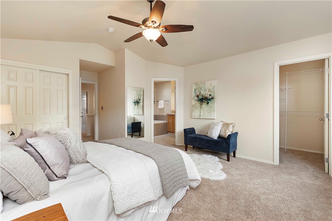 20117 Bartlett Road Bothell, WA 98012 - Photo 22 of 32 a bedroom with a bed couch and a window
