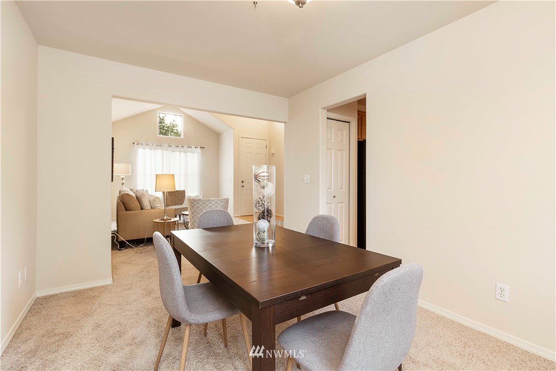 20117 Bartlett Road Bothell, WA 98012 - Photo 7 of 32 a view of a dining room with furniture and wooden floor