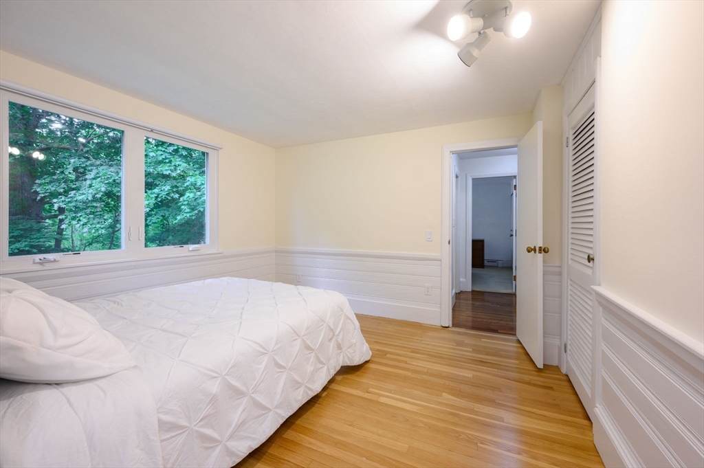 13 Smith Road Hingham, MA 02043 - Photo 13 of 32 a bedroom with a bed and a large window