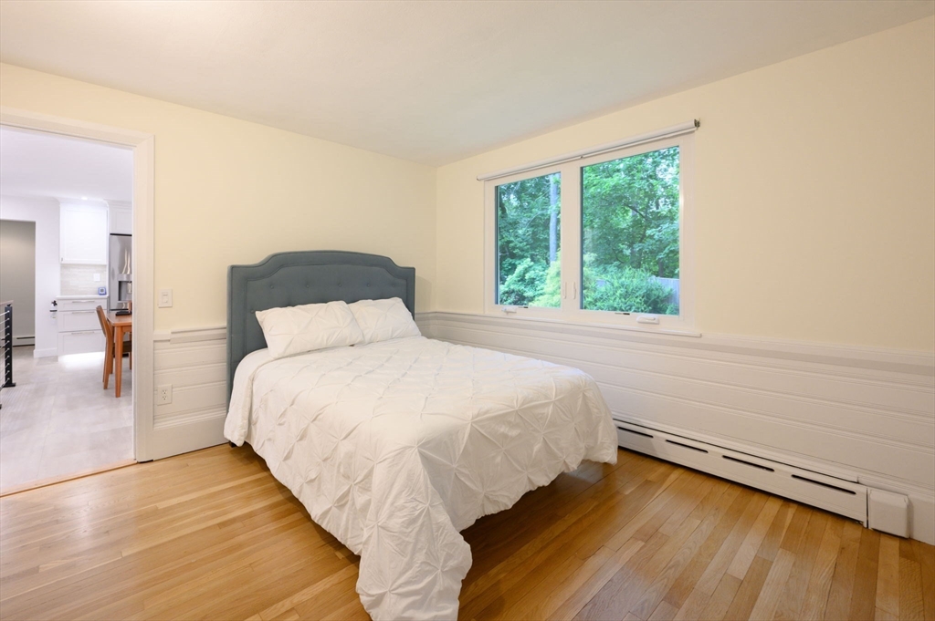 13 Smith Road Hingham, MA 02043 - Photo 14 of 32 a bedroom with a bed and a window