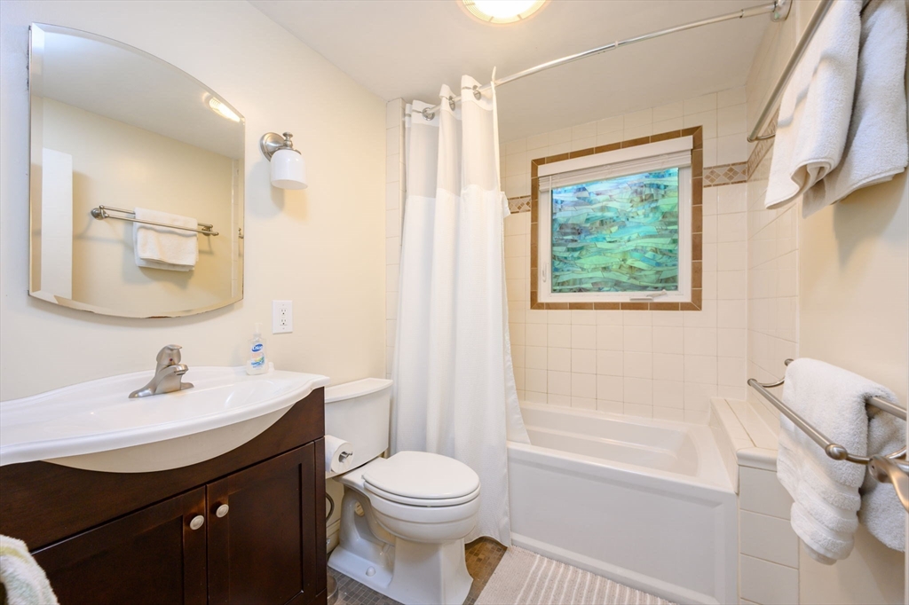 13 Smith Road Hingham, MA 02043 - Photo 15 of 32 a bathroom with a sink a toilet and shower