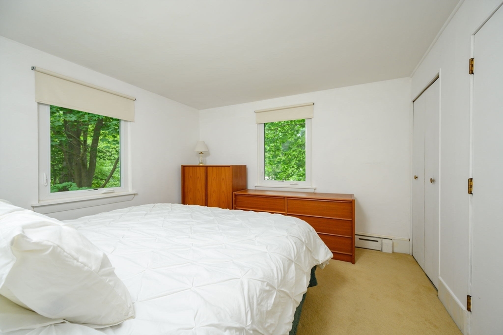 13 Smith Road Hingham, MA 02043 - Photo 17 of 32 a bedroom with a bed and a window