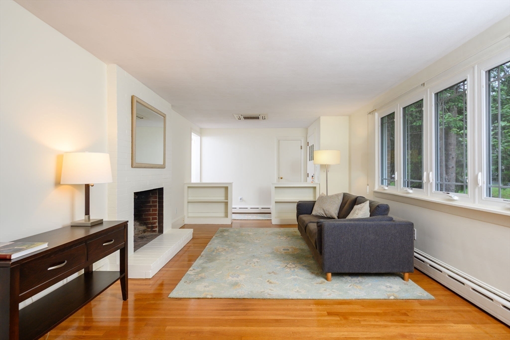13 Smith Road Hingham, MA 02043 - Photo 8 of 32 a living room with furniture and a fireplace
