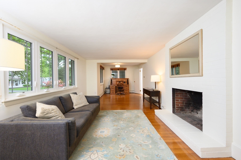 13 Smith Road Hingham, MA 02043 - Photo 9 of 32 a living room with furniture and a fireplace
