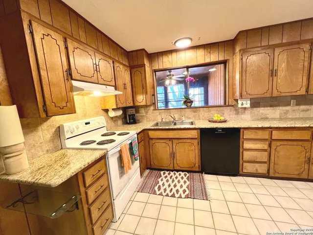 a view of hall way with furniture