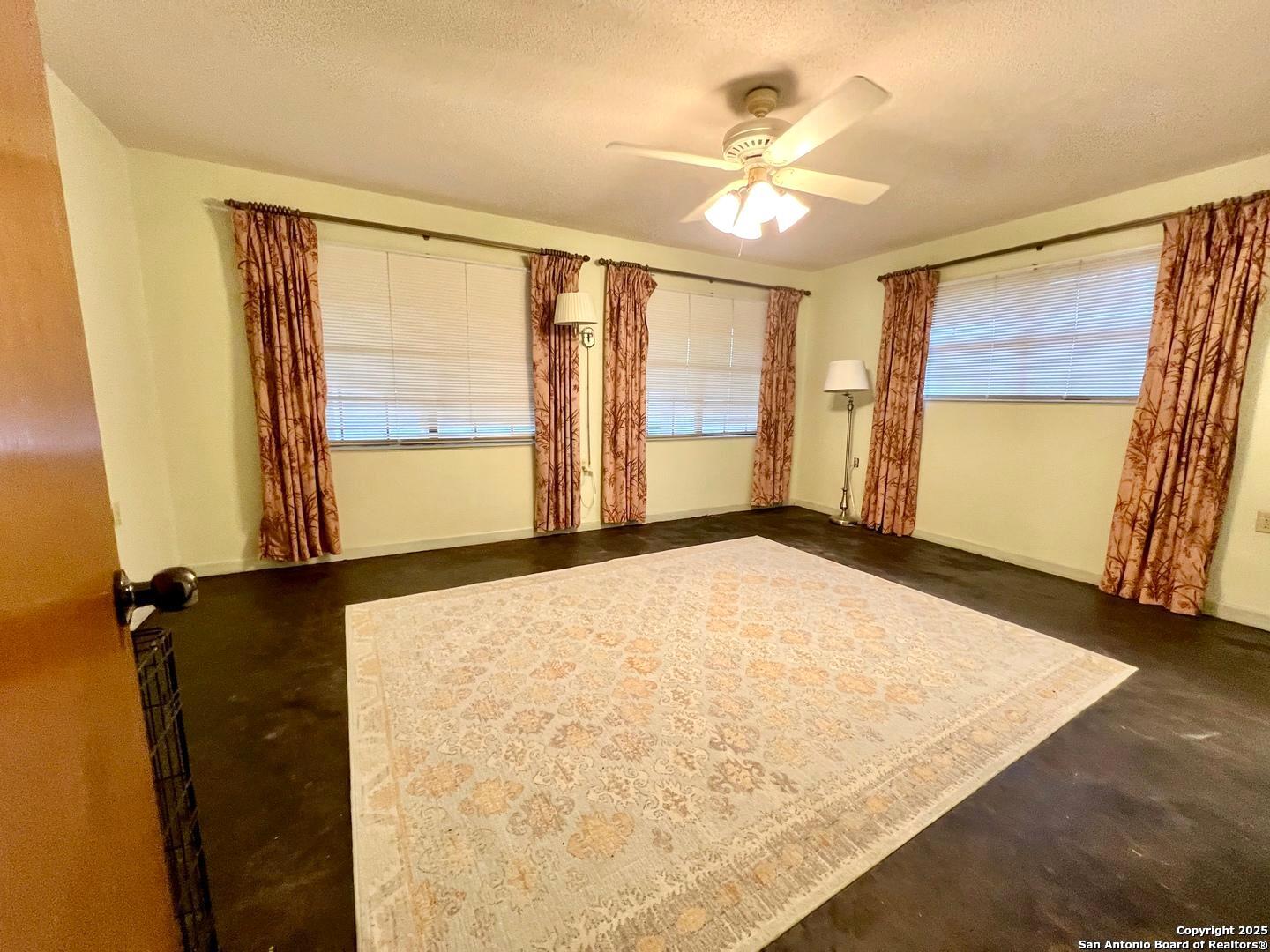 433 Fort Clark Road Brackettville, TX 78832 - Photo 19 of 46 a view of an empty room with a window