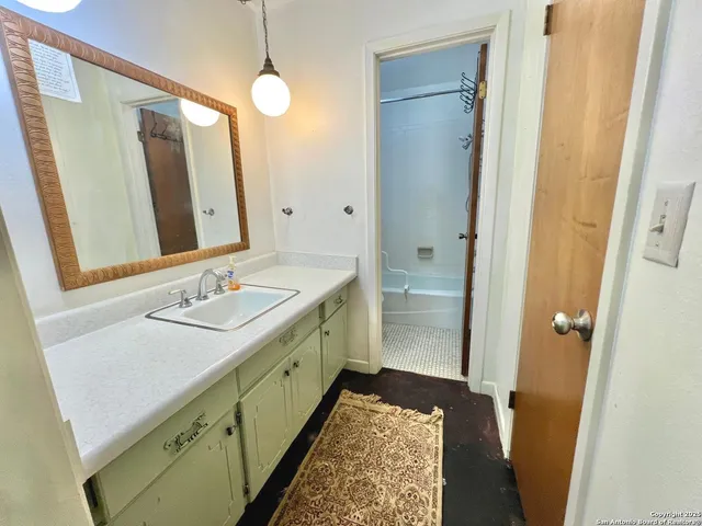 a bathroom with a sink a toilet and a bathtub