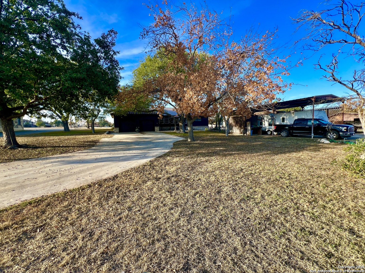 433 Fort Clark Road Brackettville, TX 78832 - Photo 29 of 46 a view of a yard with a house in the background