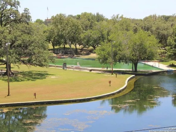 a view of lake with green space