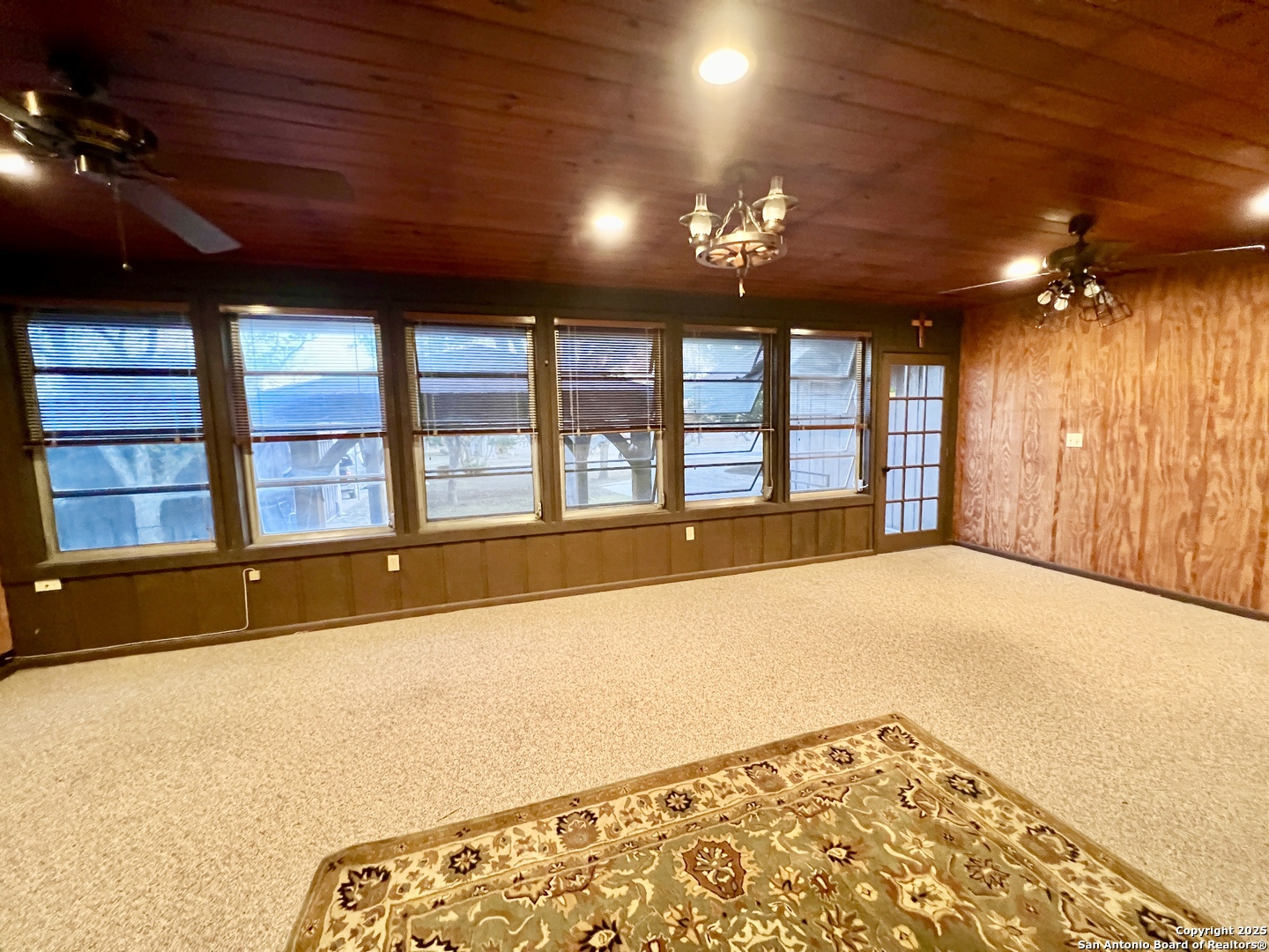 433 Fort Clark Road Brackettville, TX 78832 - Photo 42 of 46 a large room with a large window and chandelier