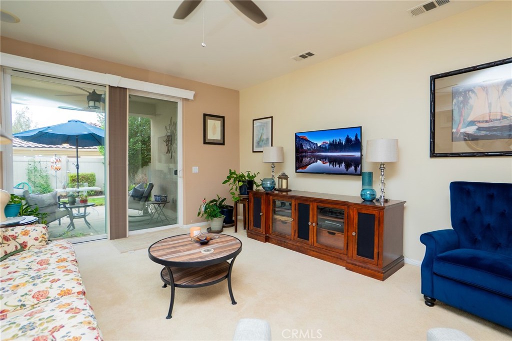 1165 Wisteria Way Beaumont, CA 92223 - Photo 11 of 49 a living room with furniture and a large window