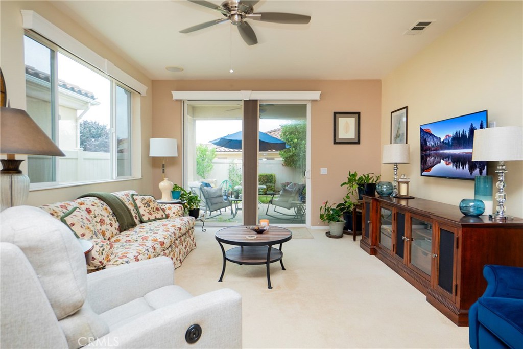 1165 Wisteria Way Beaumont, CA 92223 - Photo 12 of 49 a living room with furniture and a large window
