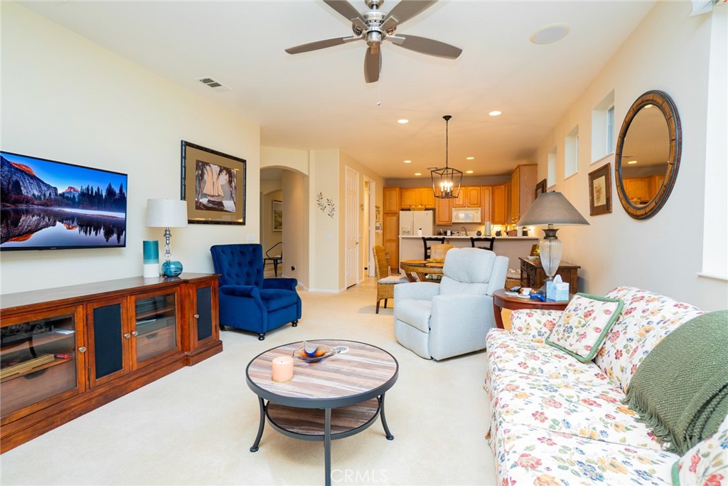 1165 Wisteria Way Beaumont, CA 92223 - Photo 13 of 49 a living room with furniture and a wooden floor