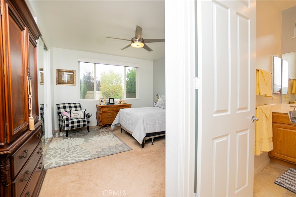 1165 Wisteria Way Beaumont, CA 92223 - Photo 25 of 49 a living room with furniture and a flat screen tv