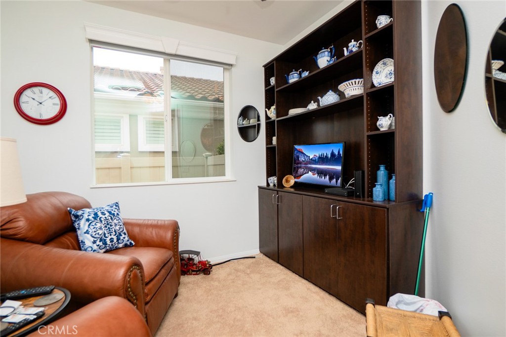 1165 Wisteria Way Beaumont, CA 92223 - Photo 27 of 49 a living room with furniture and a fireplace