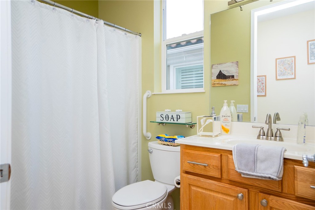 1165 Wisteria Way Beaumont, CA 92223 - Photo 29 of 49 a bathroom with a sink and a toilet