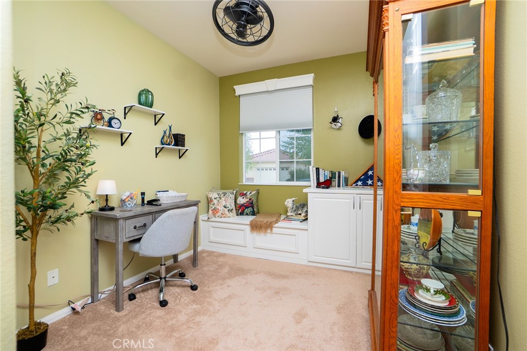 1165 Wisteria Way Beaumont, CA 92223 - Photo 30 of 49 a view of a workspace with furniture and a window