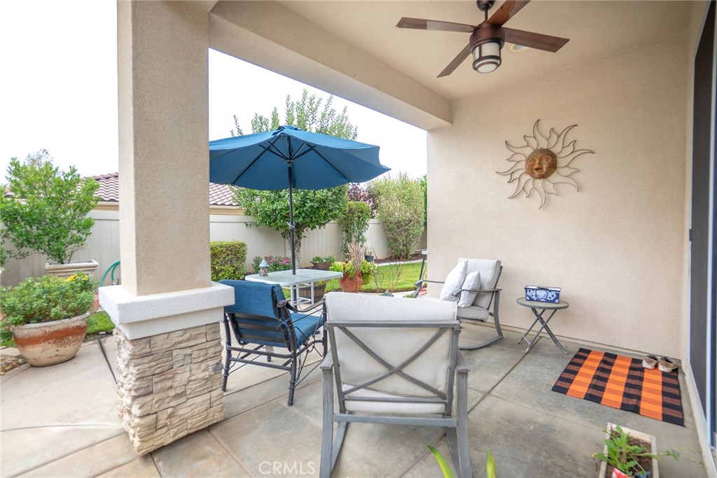 1165 Wisteria Way Beaumont, CA 92223 - Photo 34 of 49 a living room with furniture and a table