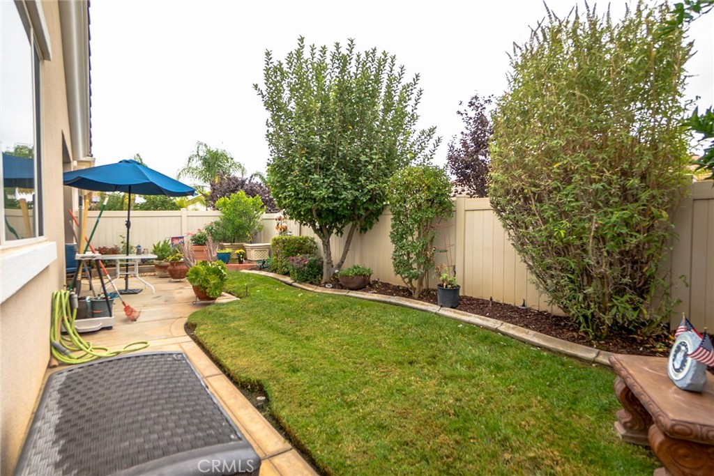 1165 Wisteria Way Beaumont, CA 92223 - Photo 37 of 49 a view of a backyard with sitting area