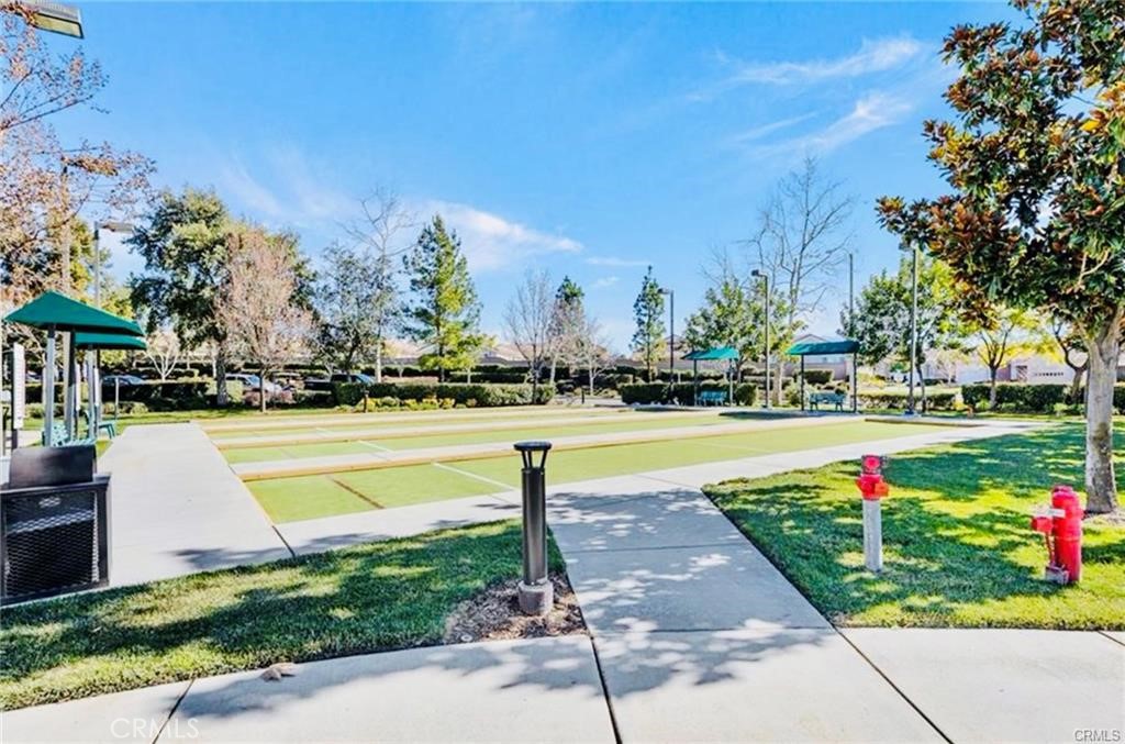 1165 Wisteria Way Beaumont, CA 92223 - Photo 45 of 49 a park view with large trees and plants