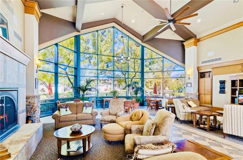 1165 Wisteria Way Beaumont, CA 92223 - Photo 47 of 49 a living room with furniture fireplace and a large window