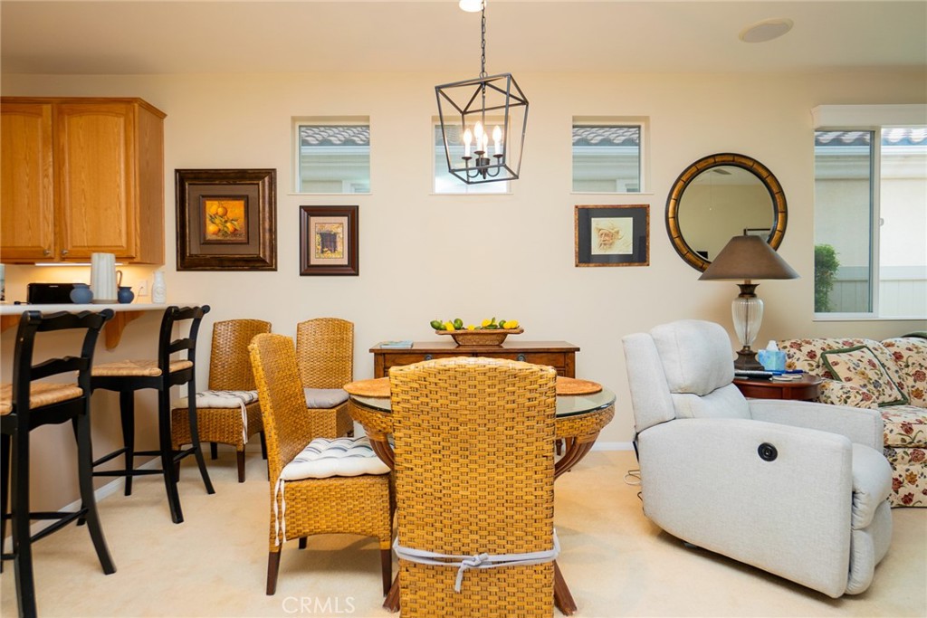1165 Wisteria Way Beaumont, CA 92223 - Photo 7 of 49 a dining room with furniture and a window