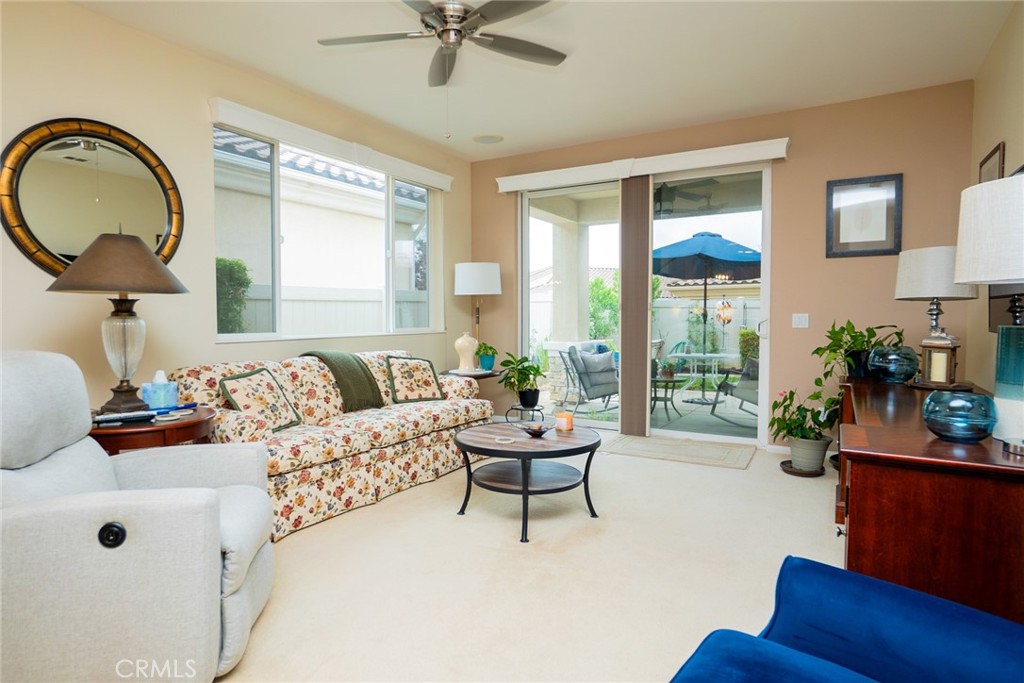 1165 Wisteria Way Beaumont, CA 92223 - Photo 8 of 49 a living room with furniture and a large window