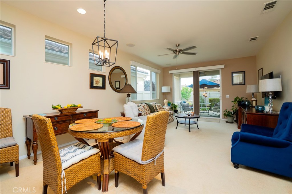 1165 Wisteria Way Beaumont, CA 92223 - Photo 9 of 49 a view of a dining room with furniture