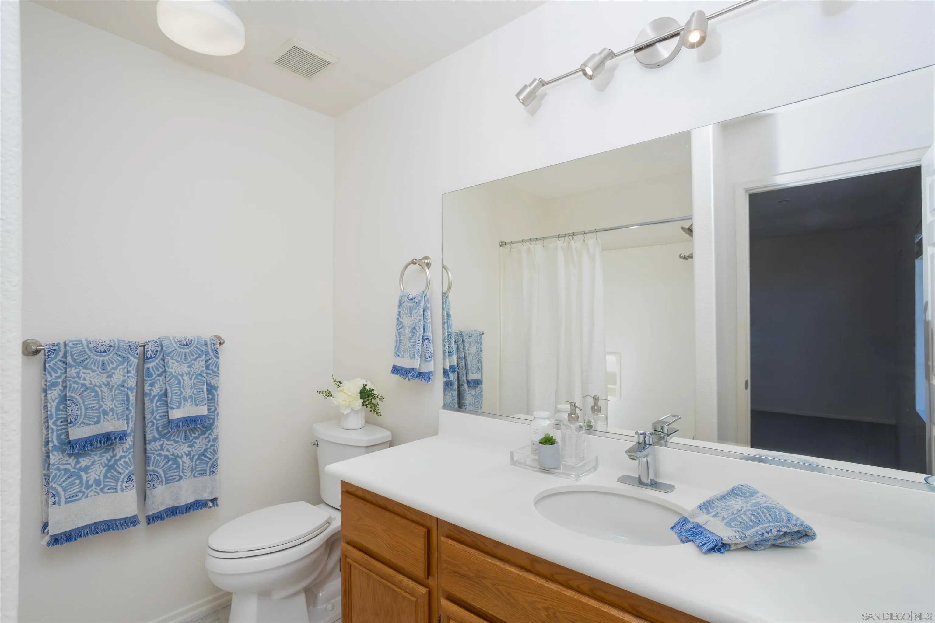 2168 Pointe Parkway Spring Valley, CA 91978 - Photo 20 of 50 a bathroom with a granite countertop sink toilet and shower