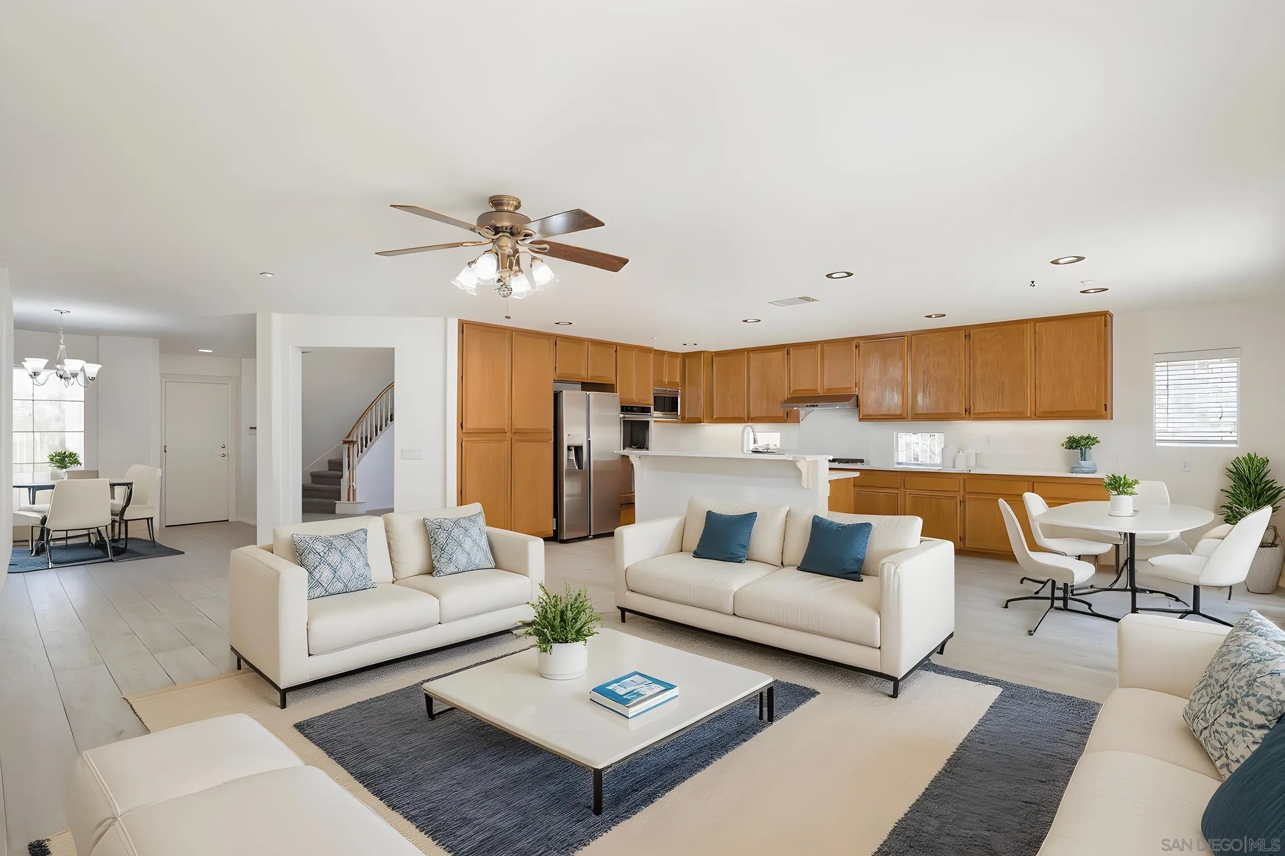 2168 Pointe Parkway Spring Valley, CA 91978 - Photo 2 of 50 a living room with furniture kitchen view and a chandelier