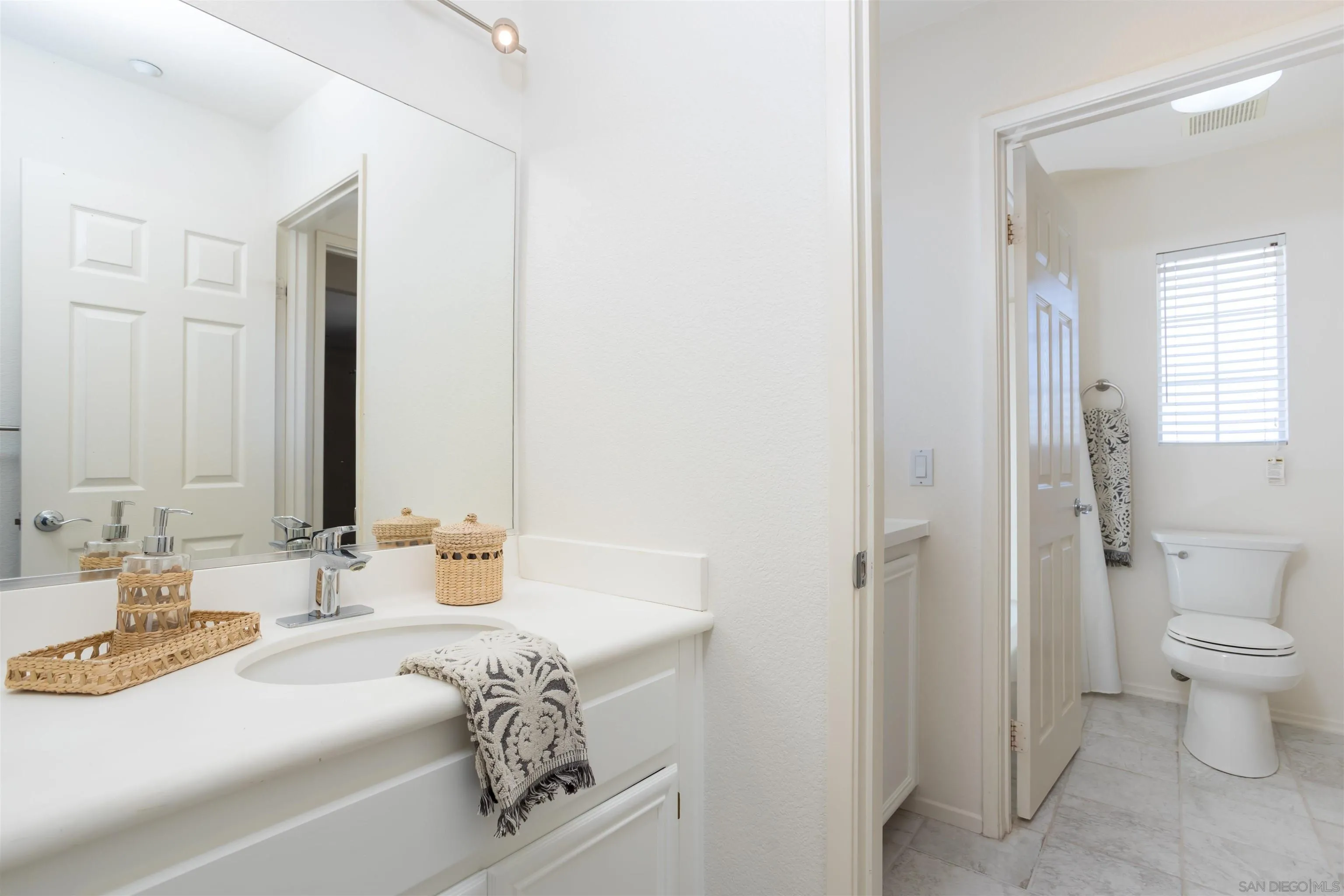 2168 Pointe Parkway Spring Valley, CA 91978 - Photo 28 of 50 a en suite bathroom with a sink and a mirror