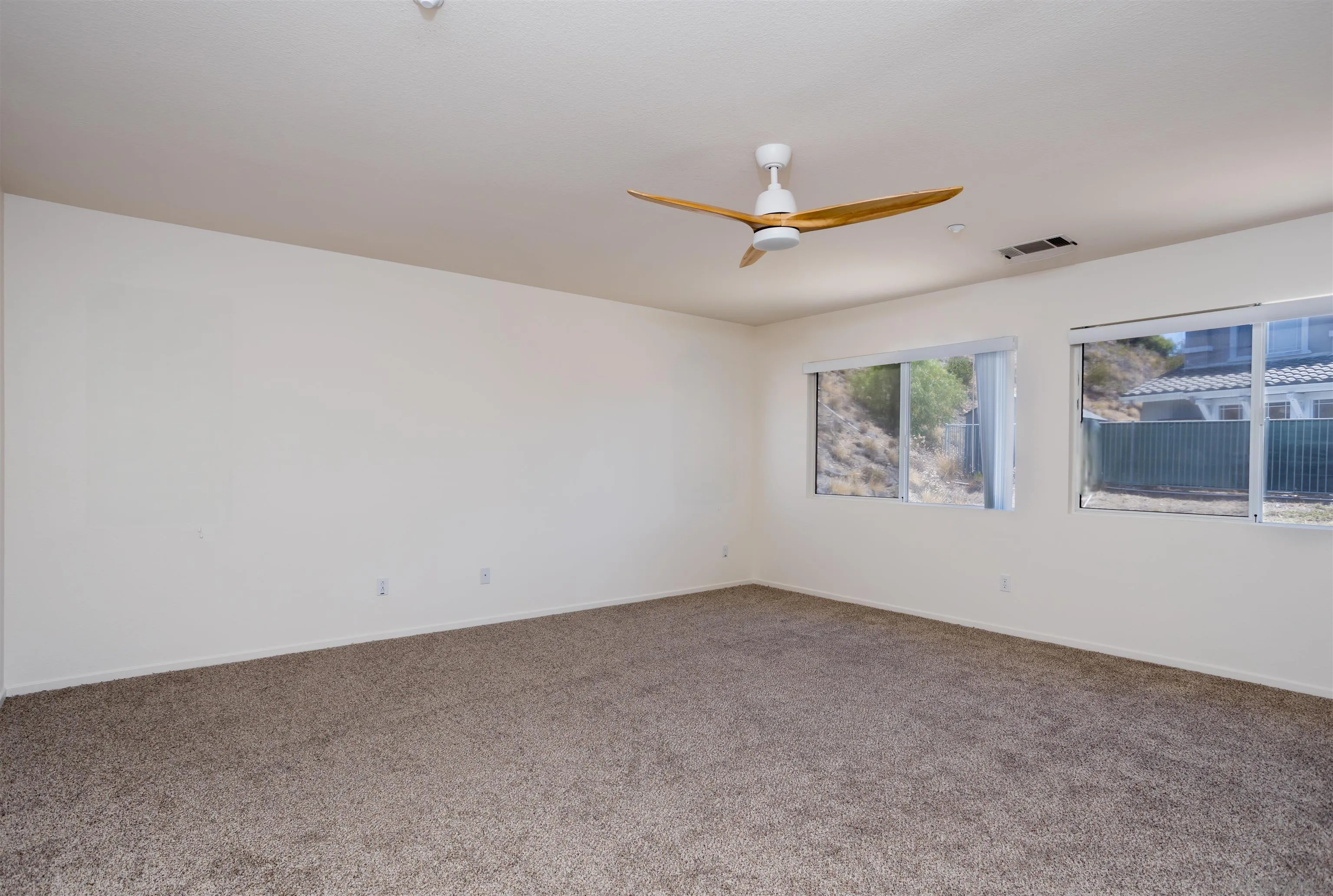2168 Pointe Parkway Spring Valley, CA 91978 - Photo 30 of 50 an empty room with windows and fan