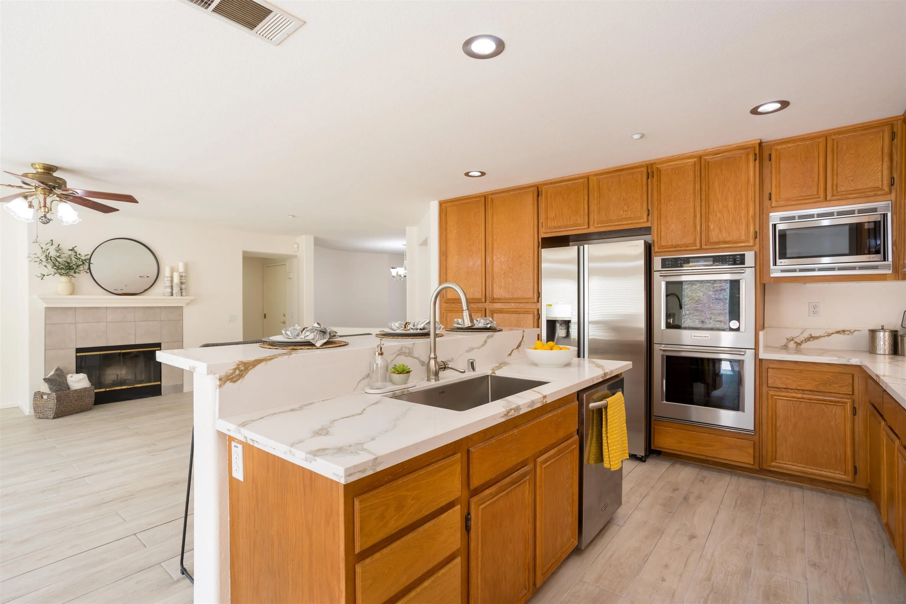 2168 Pointe Parkway Spring Valley, CA 91978 - Photo 3 of 50 a kitchen that has a lot of cabinets in it and wooden floor