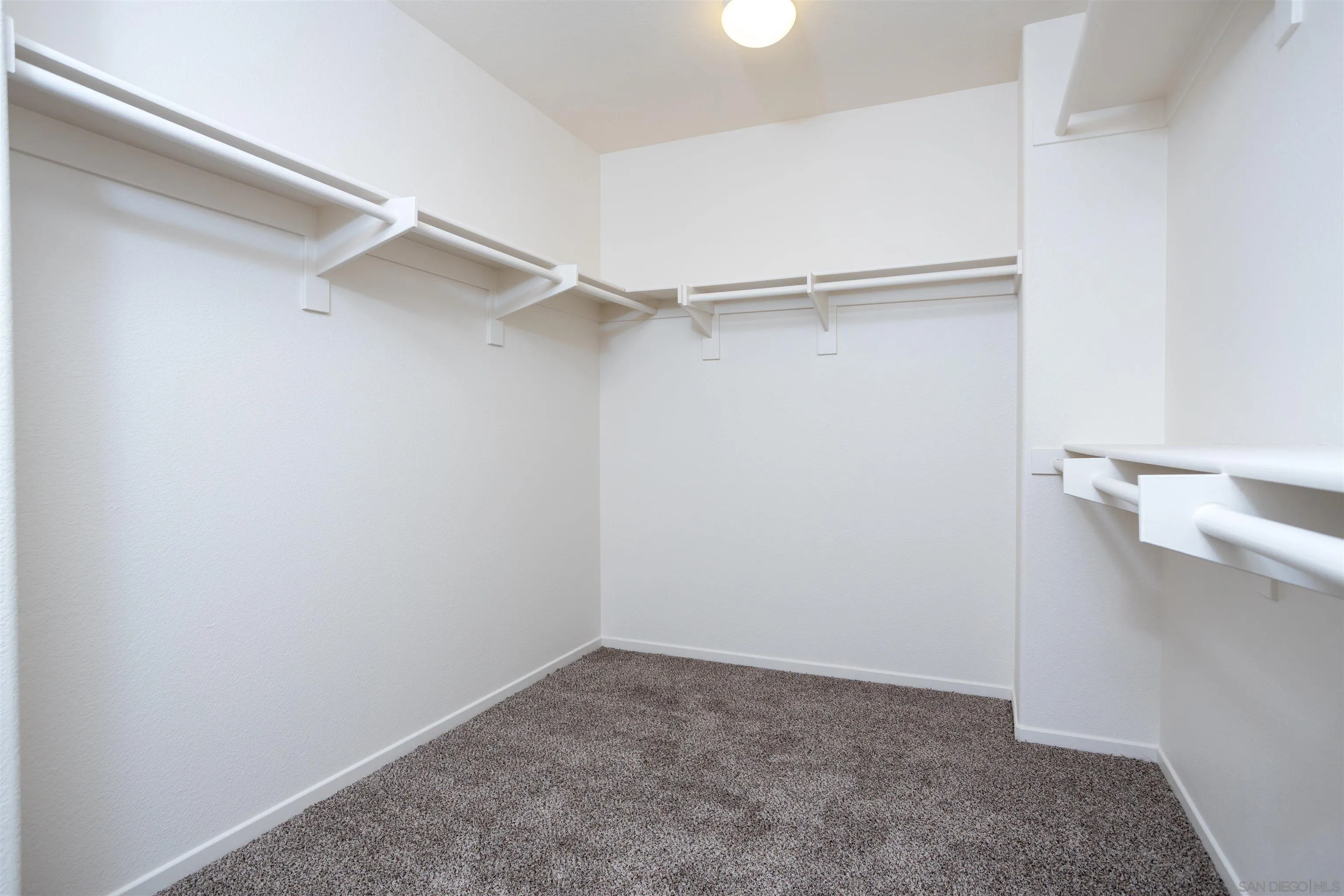 2168 Pointe Parkway Spring Valley, CA 91978 - Photo 33 of 50 a view of walk in closet with empty racks