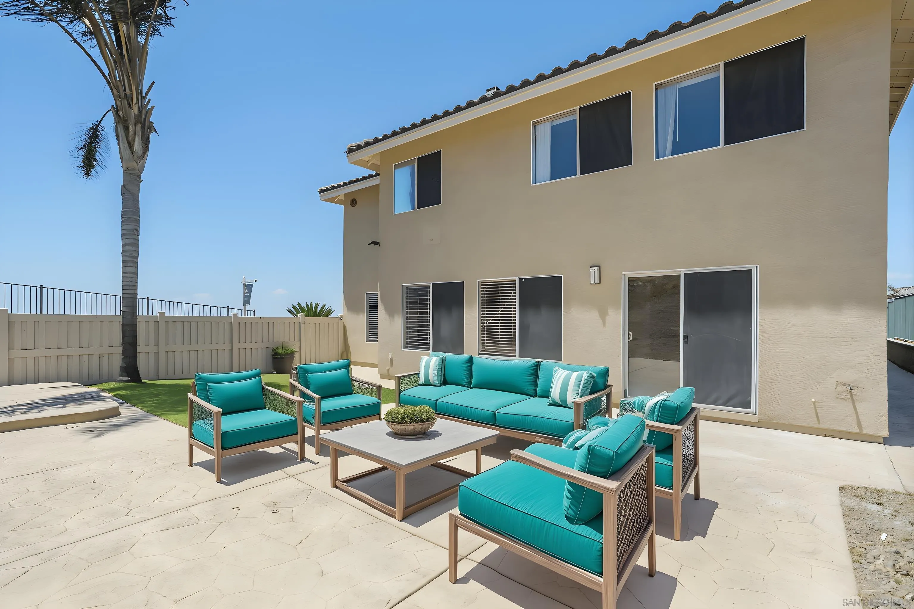 2168 Pointe Parkway Spring Valley, CA 91978 - Photo 35 of 50 a backyard of a house with sofas table and chairs