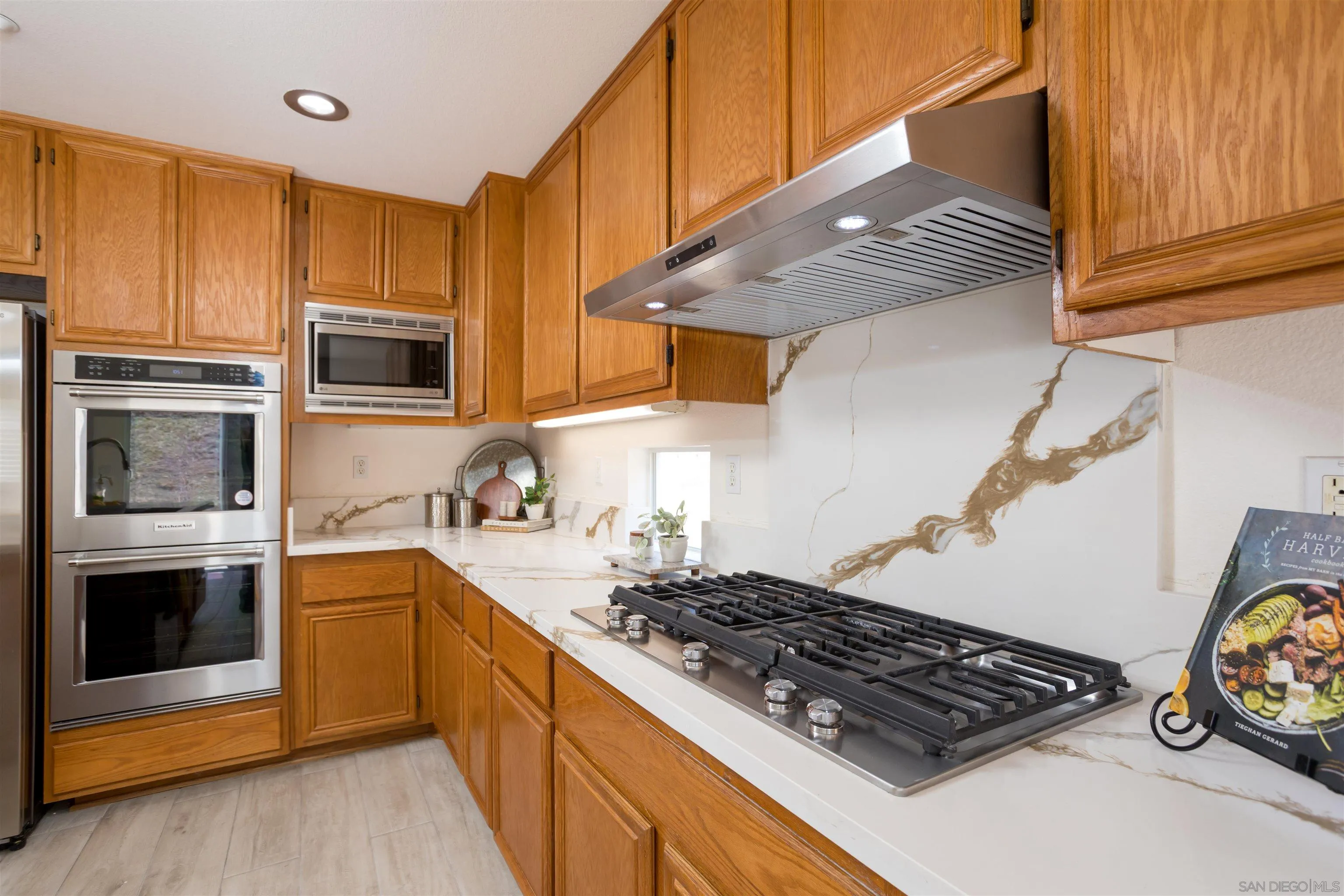2168 Pointe Parkway Spring Valley, CA 91978 - Photo 6 of 50 a kitchen with stainless steel appliances granite countertop a stove and a sink