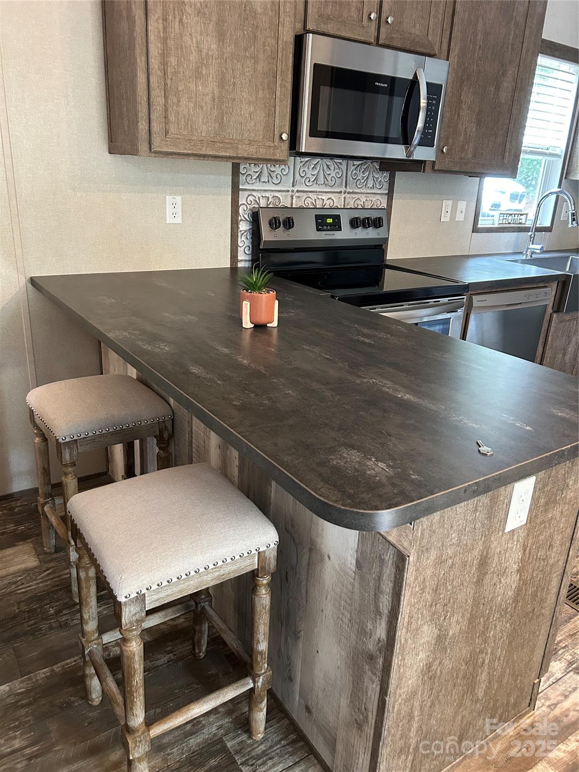 365 Rock Road Rutherfordton, NC 28139 - Photo 15 of 31 a kitchen with a stove and a microwave