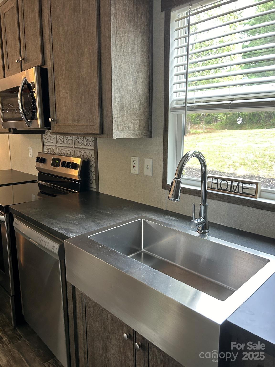 365 Rock Road Rutherfordton, NC 28139 - Photo 17 of 31 a kitchen with a sink and a window