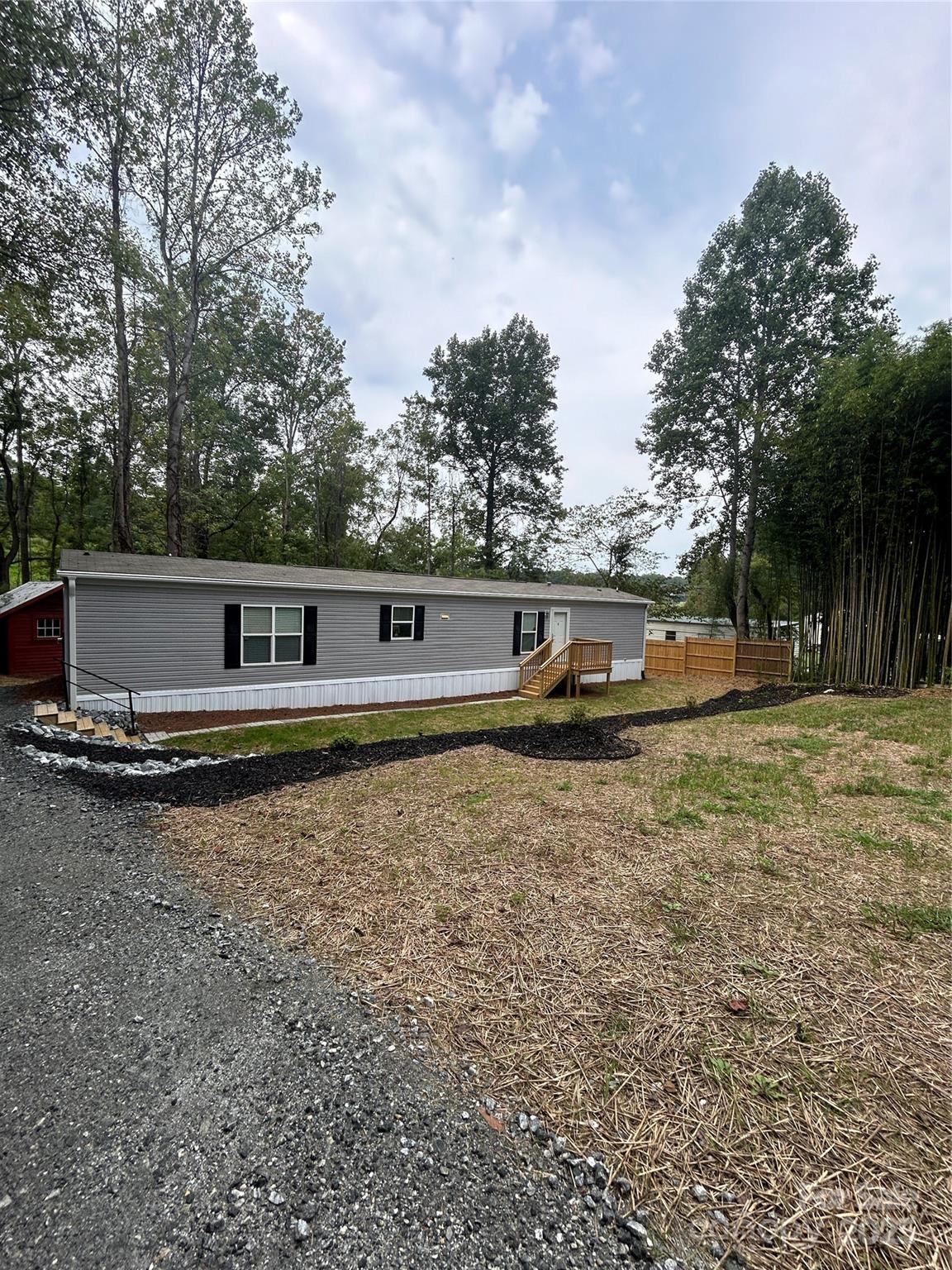 365 Rock Road Rutherfordton, NC 28139 - Photo 3 of 31 a front view of a house with a yard
