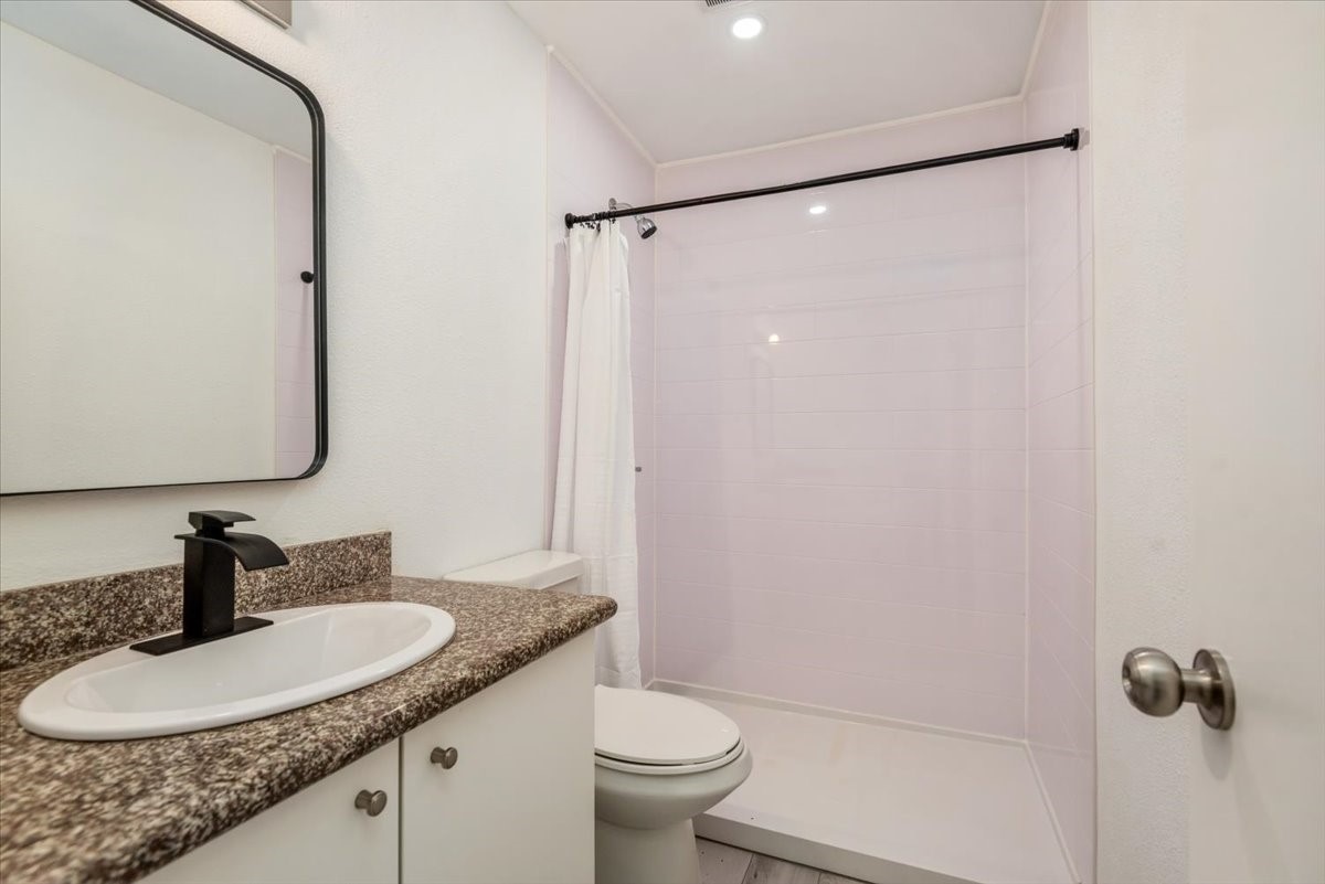 9616 Long Point Road, Unit 63 Houston, TX 77055 - Photo 16 of 17 Renovated bathroom with updated design and modern touches.