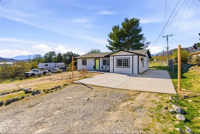 a house with trees in the background