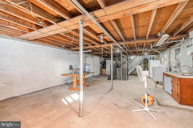 a view of a white house with a snow on the road