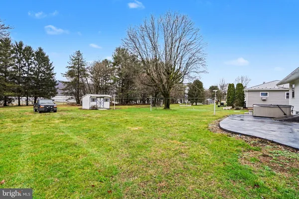 a view of a house with a big yard