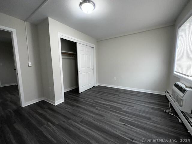 40-1 Prospect Street, Unit 2B Norwalk, CT 06850 - Photo 3 of 13 an empty room with wooden floor and windows