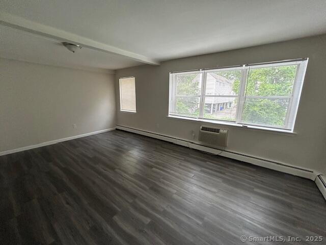40-1 Prospect Street, Unit 2B Norwalk, CT 06850 - Photo 9 of 13 a view of an empty room with wooden floor and a window
