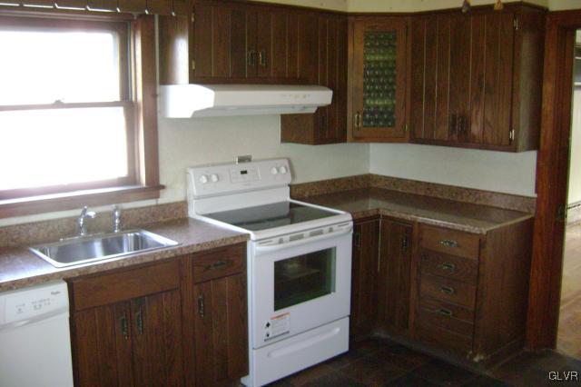 Kunkletown Road Kunkletown, PA 18058 - Photo 3 of 14 a kitchen with a stove sink and cabinets